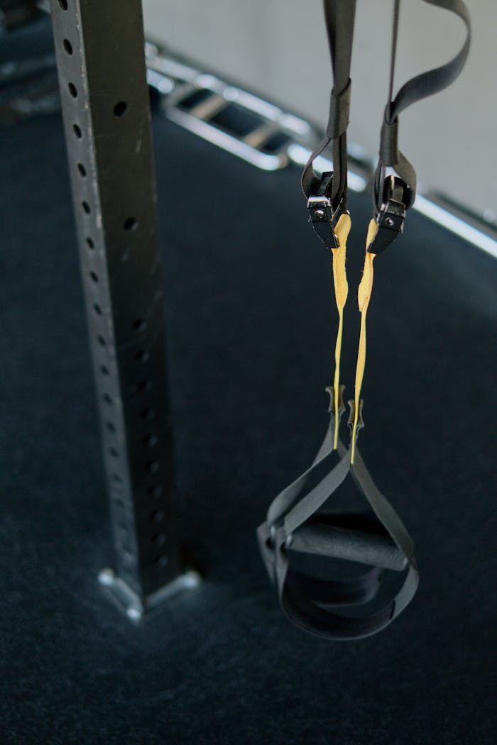 Close-up of a suspension trainer at a gym, perfect for fitness enthusiasts seeking versatile workouts.